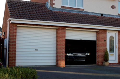 Gliderol Glide-Rol-a-Door installed on home with expensive Audi car in garage