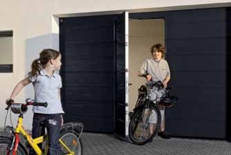 pedestrian entrance doors within a garage door for ease of use