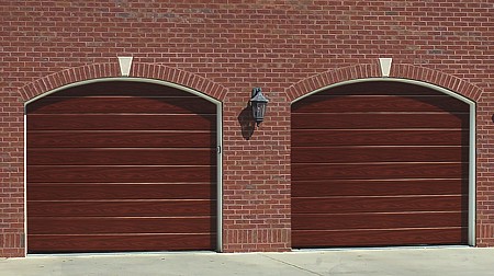 Hormann M Ribbed sectional garage door in Golden Oak Decograin