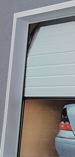 sectional door installed behind opening