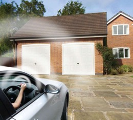Novoferm garage door installed on home with automatic electric operation opener