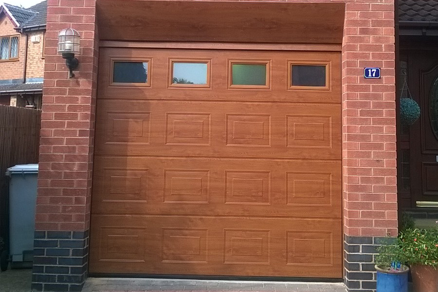 Timber sectional garage door with windows