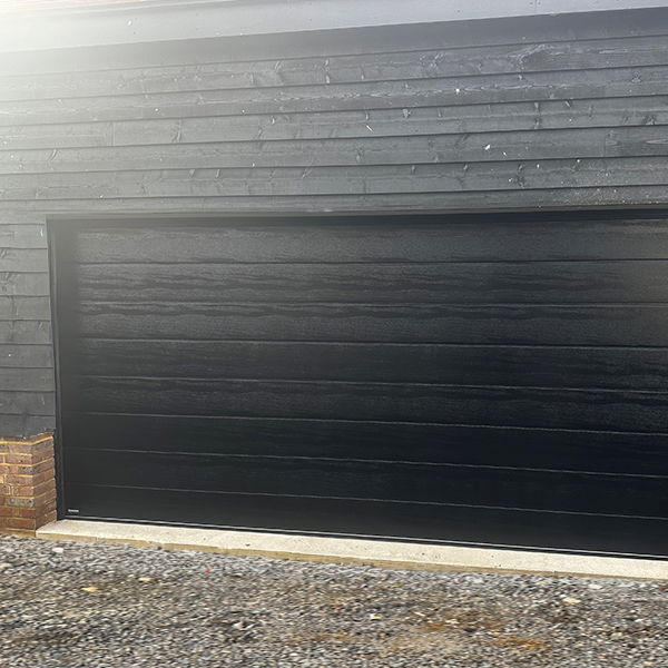 CarTeck Centre Rib sectional garage door in black