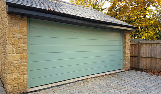 Sectional garage door in chartwell green