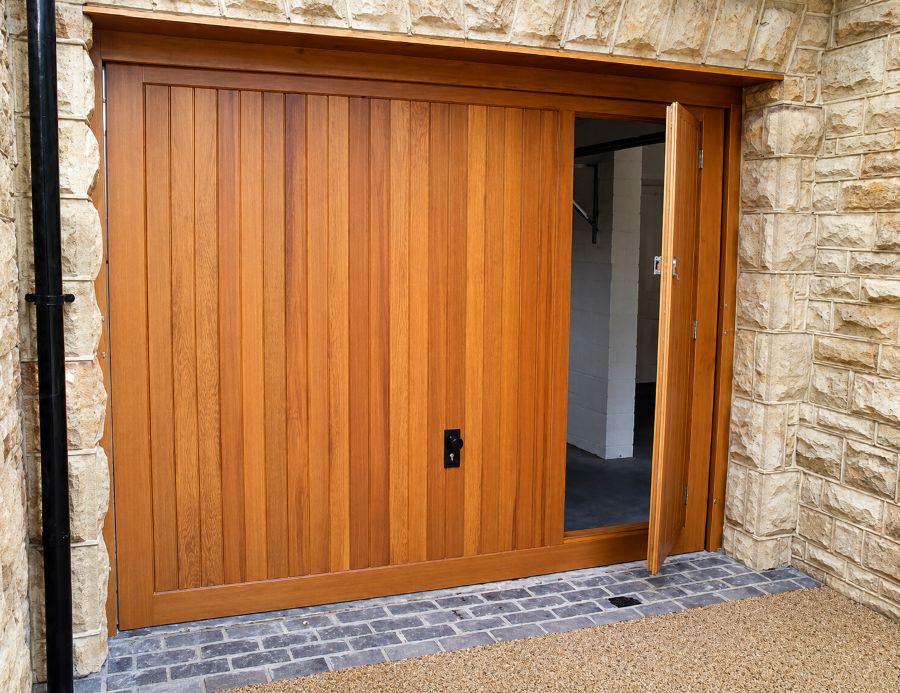 Garage door with built-in pedestrian access door